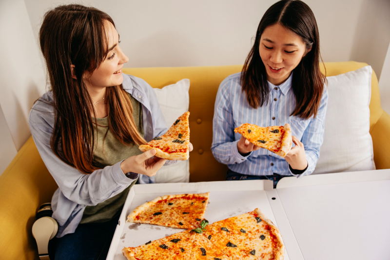 content young girls having pizza