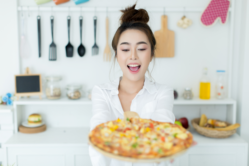 woman enjoying pizza